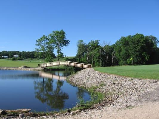 Picture of Hole #23 with the bridge in the back ground at Airport National Public Golf Range and Mini.