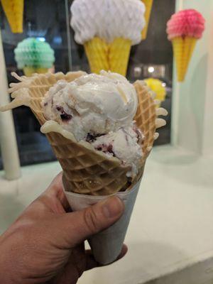 Blueberry Cheesecake icecream in a freshly made waffle cone