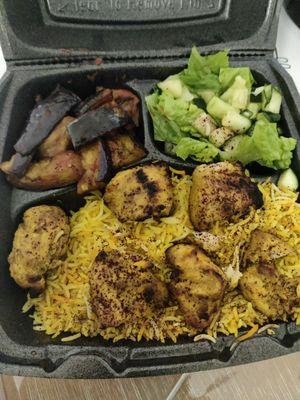 Chicken kabob plate with eggplant and salad