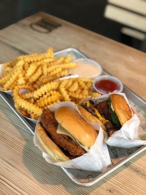 Spicy chicken and shake shack burger with cheese fries and regular fries