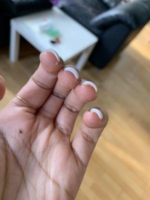 Messy nail polish under the nail and on finger