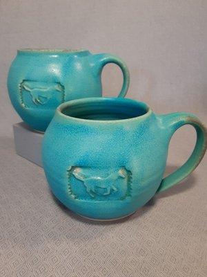 The favorite glaze color and one of the favorite horse designs. One of 3 different mug shapes that are available.