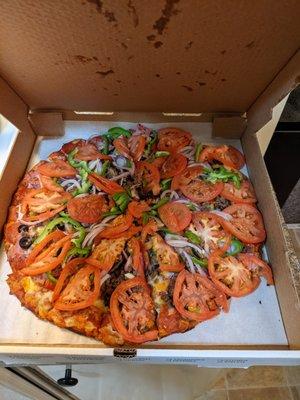 The amazing pizza I ordered all dazzled up with some tomatoes