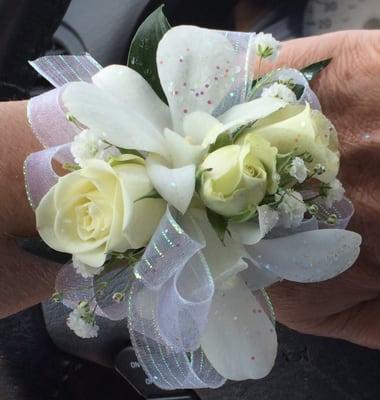 All white corsage. Reasonably priced.