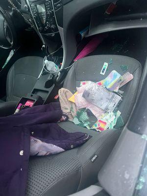 This is inside the car they broke in I am just so disappointed at this apartment complex this is all nonsense I am so done with this