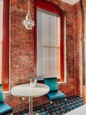 Cutest brick walls inside with huge windows!