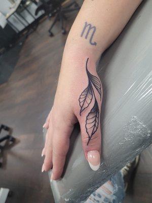 thumb tattoo