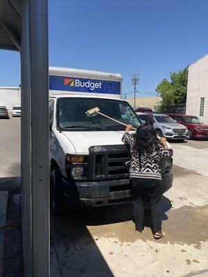 Here we have Star washing my windshield after a 45 minute wait too bad she missed the rest of the truck and the garbage inside