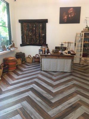 Beautiful chevron pattern in the flooring creates an exquisite setting for this beautiful studio!