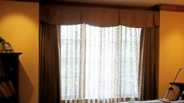 Claremont valance with blackout lined pleated draperies .