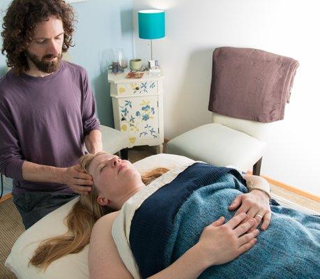 John treating a client at his office in NE Portland.