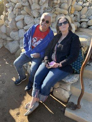 Niece & Husband sitting on stone bench