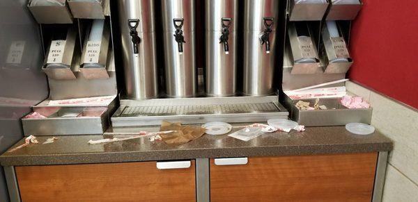 This is the nastiest and filthiest Wendy's I've seen. All tables were dirty. Trash on floor. This is the area around the drink machine.