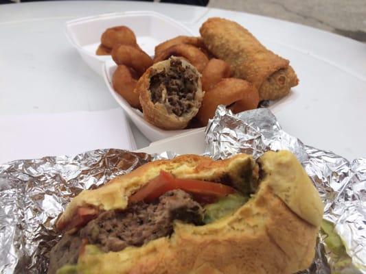 Burger, cheesesteak egg rolls, onion rings.