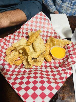 Chicharones and it looks like queso but the sauce is like a mayo-based deliciousness.