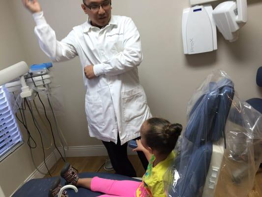 My little girl chatting with the dentist.  She loves Evergreen Dental Arts!