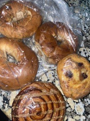 3 cinnamon raisin bagels 1 blueberry muffin and a cinnamon roll