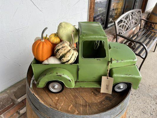 Who doesn't love a green truck with pumpkins?