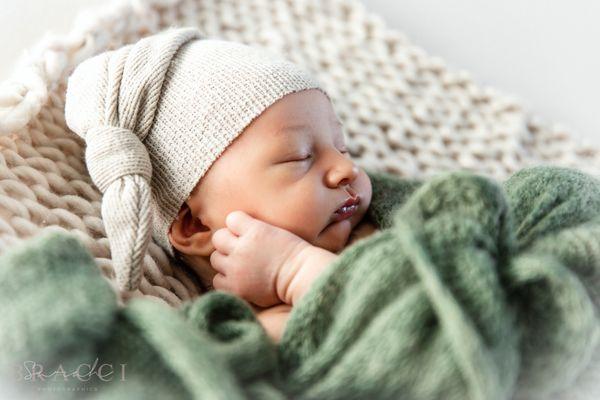 A newborn baby photo session with Sarah Bracci Photographics. Posed newborn babies are best within the first 5 weeks for studio posing.