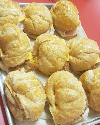 Breakfasts: Sausage egg and cheese on croissants , Ham egg and cheese on croissants, Becon egg and cheese on croissants.