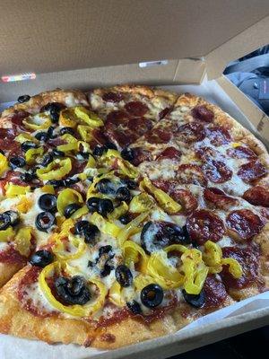 Beef pepperoni pizza with black olives and banana peppers