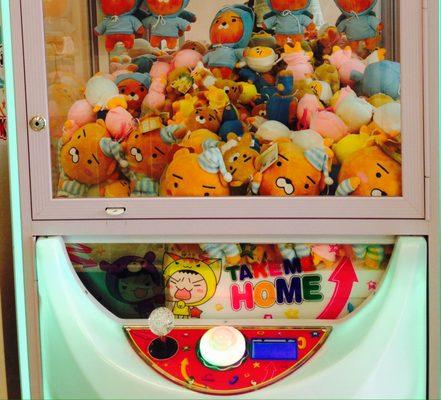 The Claw Toy Grabber Machine - insert 2 coins to play