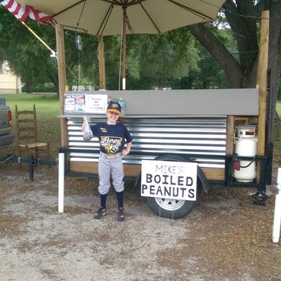 Miss. Shyanne at Mikes Boiled peanut wagon showing her team spirit and enjoying some delicious boiled peanuts.