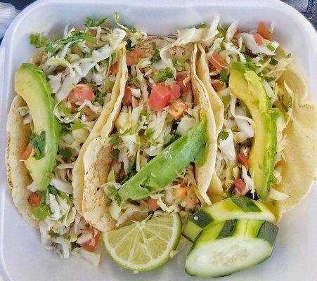 Grilled fish and shrimp tacos. Handmade tortillas.