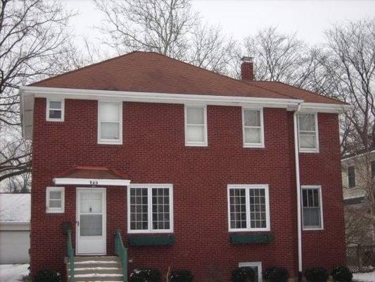 Grinding and tuckpointing entire home, rebuilding chimney from roof-line up and installing a chimney cap