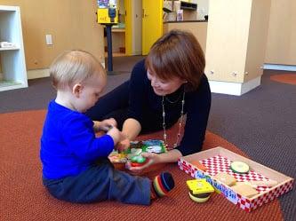 Dr. Mamiko with child playing the burger game!