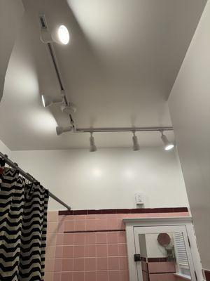 Bathroom crack repair, painting, and lighting update