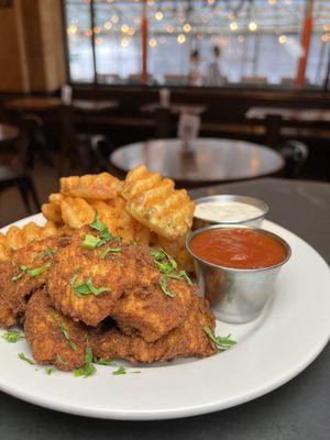 Crispy fried chicken tenders and waffle fries. 
Come try One of our best sellers! .