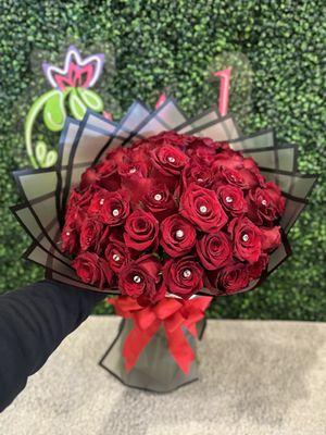 A beautiful arrangement of 60 wrapped red roses, perfect for that special person.