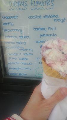 Raspberry roadrunner ice cream in a waffle cone