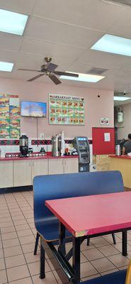 Cofee & Tea Station with Menu board of sandwiches offered.