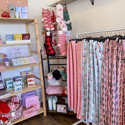 Christmas pajamas are the best gifts! Shop cozy loungewear, fuzzy socks and cozy slippers at Lyla's Clothing and Gifts this christmas season