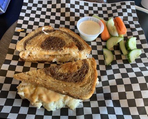 Great price for a Turkey Reuben sandwich with sauerkraut, cheese, and thousand island dressing on rye bread with side of fresh veggies $9.95