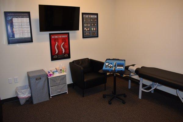 Exam Room with our state-of-the-art FDA approved spinal scanning equipment.