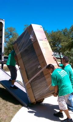 Moving an oversize glass quiro cabinet protected with cardboard!!