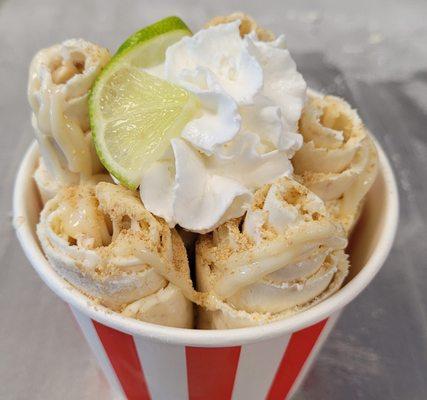 Key Lime Pie chopped and rolled, drizzled with Key Lime condensed milk, topped with crushed Graham cracker, Lime slice and whip cream