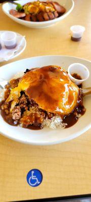 Regular Loco Moco. White rice, ground beef patty cooked to your liking, 2 eggs cooked to your liking, all topped with brown gravy.