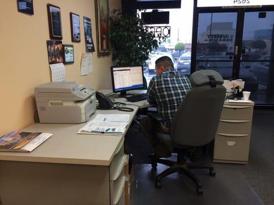 This is Ramon.  He is checking the computer to see if he can save money on his client's auto policy.