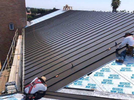 Installing McElroy Galvalume Standing Seam Metal Panels at the American Martyr's Church in Manhattan Beach, CA.