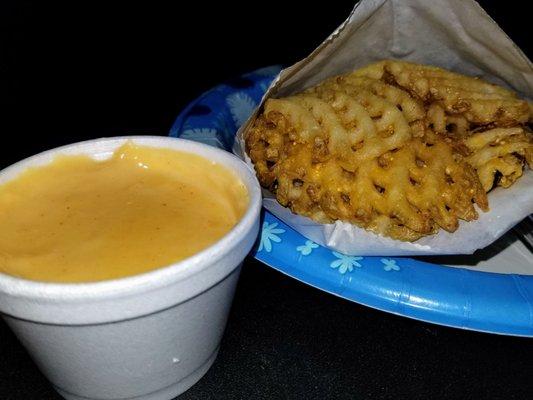 Waffle fries w/ side of cheese for dippin'.