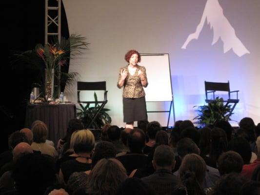 Susan Berkley on stage at one of her various public speaking events.