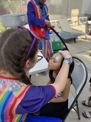 Unicorn face painting with Alyssa V.