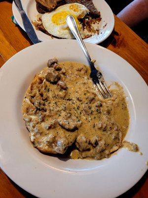 Biscuits (2) and gravy w/ sides of 2 eggs, toast, hash browns. There is also a choice of meat (bacon, sausage, or ham) $12.00