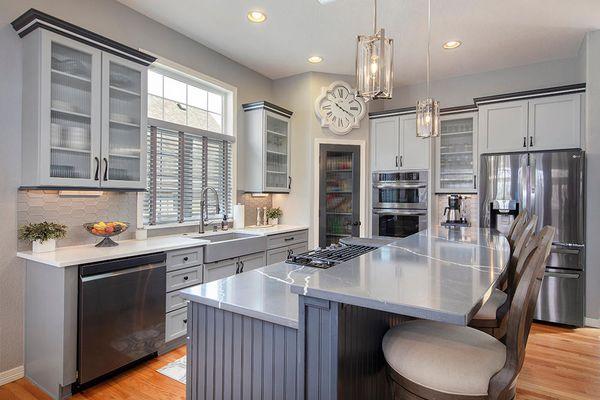 Blue and gray kitchen cabinets after cabinet painting