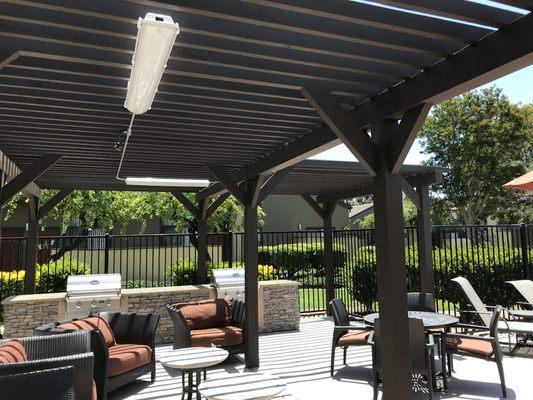 Outdoor led light fixtures for a pergola sitting & BBQ area.