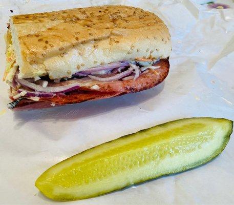 Half of a Submarine with Slaw, Onion and Peppers.